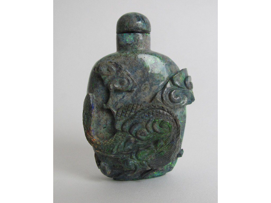 Appraisal: A Chinese opal snuff bottle carved in high relief with