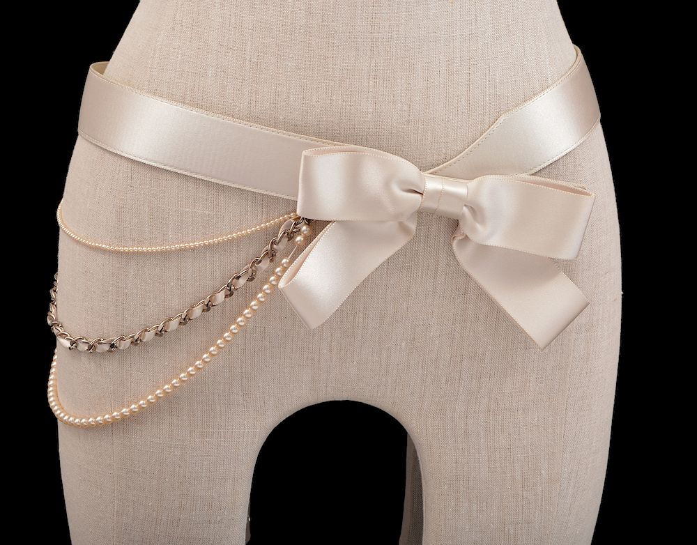 Appraisal: Chanel Beige Satin Bow Pearl Chain Belt This beige satin