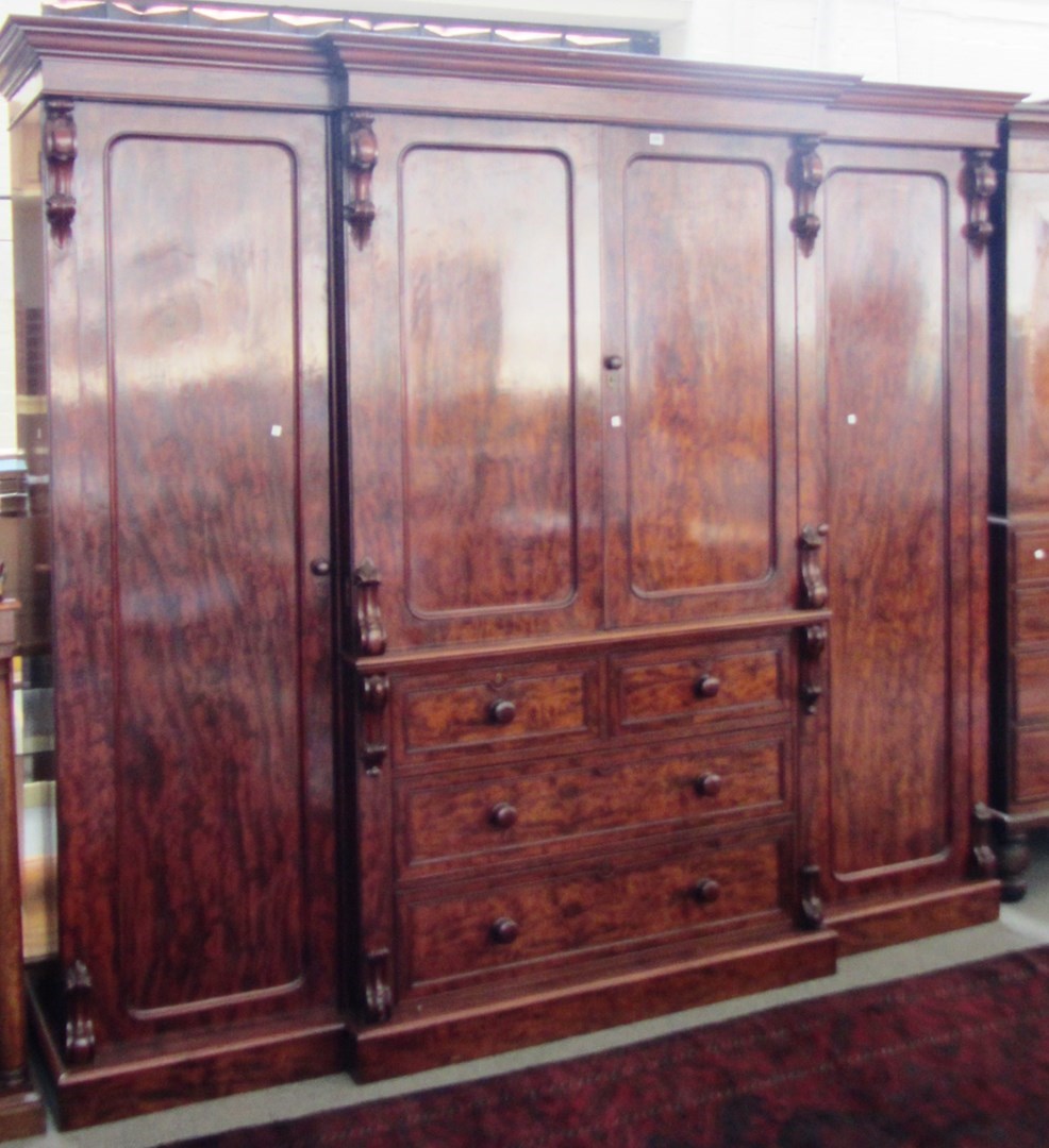 Appraisal: A William IV mahogany breakfront wardrobe with pair of panel