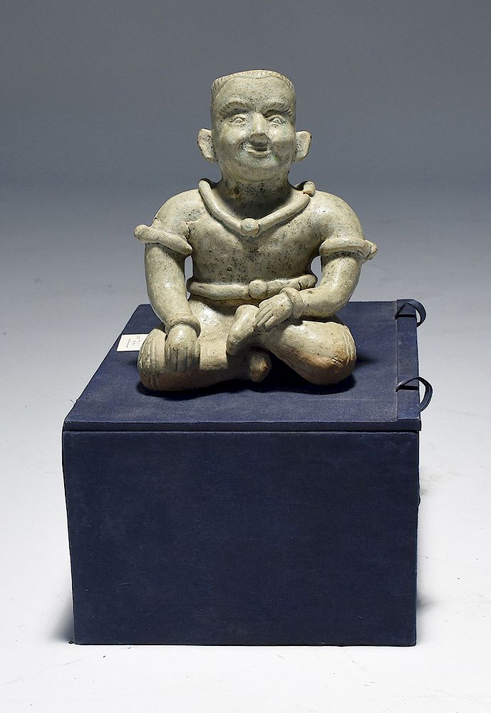 Appraisal: Asian celadon glazed pottery figure of seated man Asian celadon