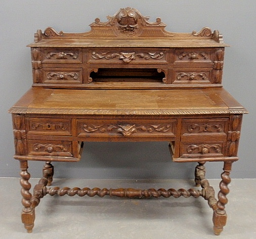 Appraisal: - Baroque style carved oak desk c with carved wolf