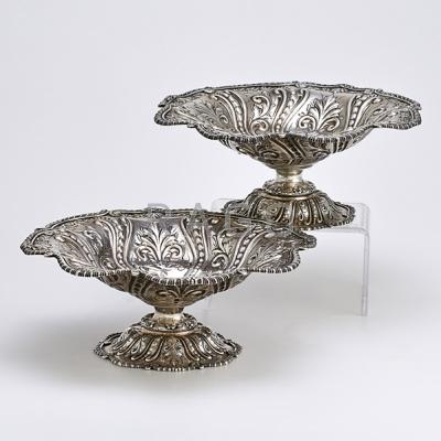 Appraisal: PAIR OF HOWARD CO STERLING ROCOCO COMPOTES Chased bowl and