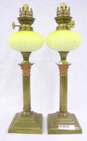 Appraisal: Pair of early th century oil lamps with yellow satin