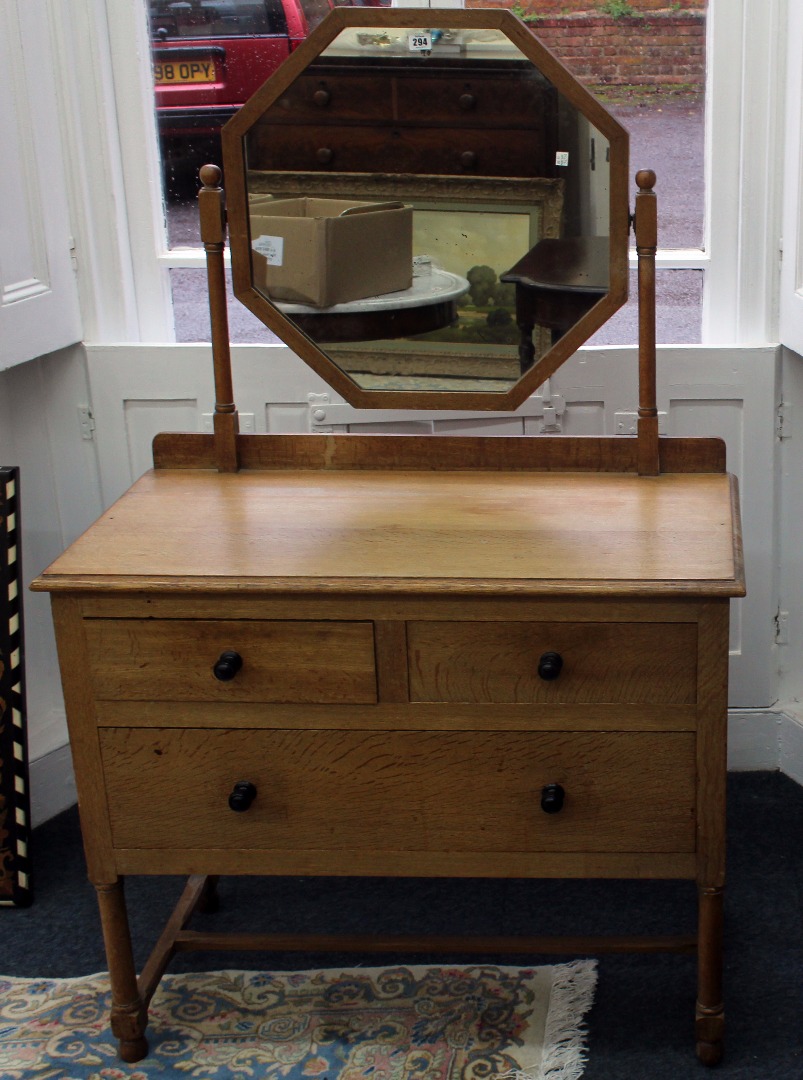 Appraisal: A light oak Arts Crafts dressing table with octagonal mirror