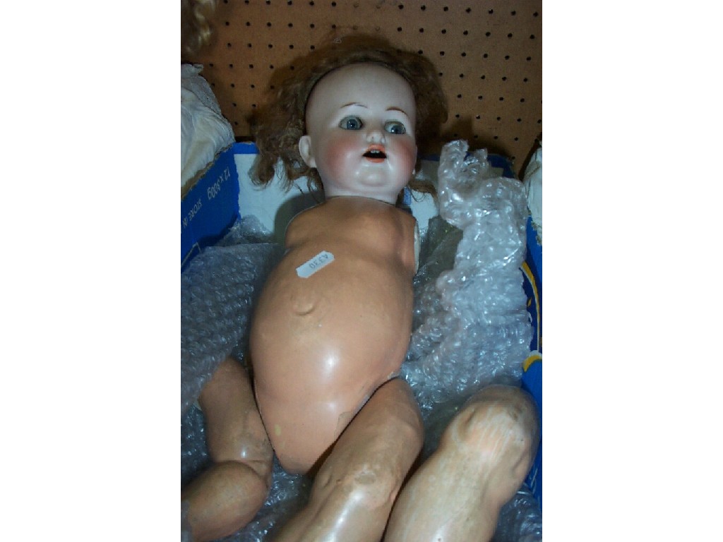 Appraisal: A German bisque headed doll with closing eyes and open