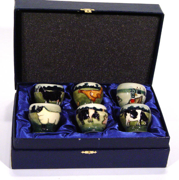 Appraisal: Set of six Moorcroft eggcups hand painted and tube lined