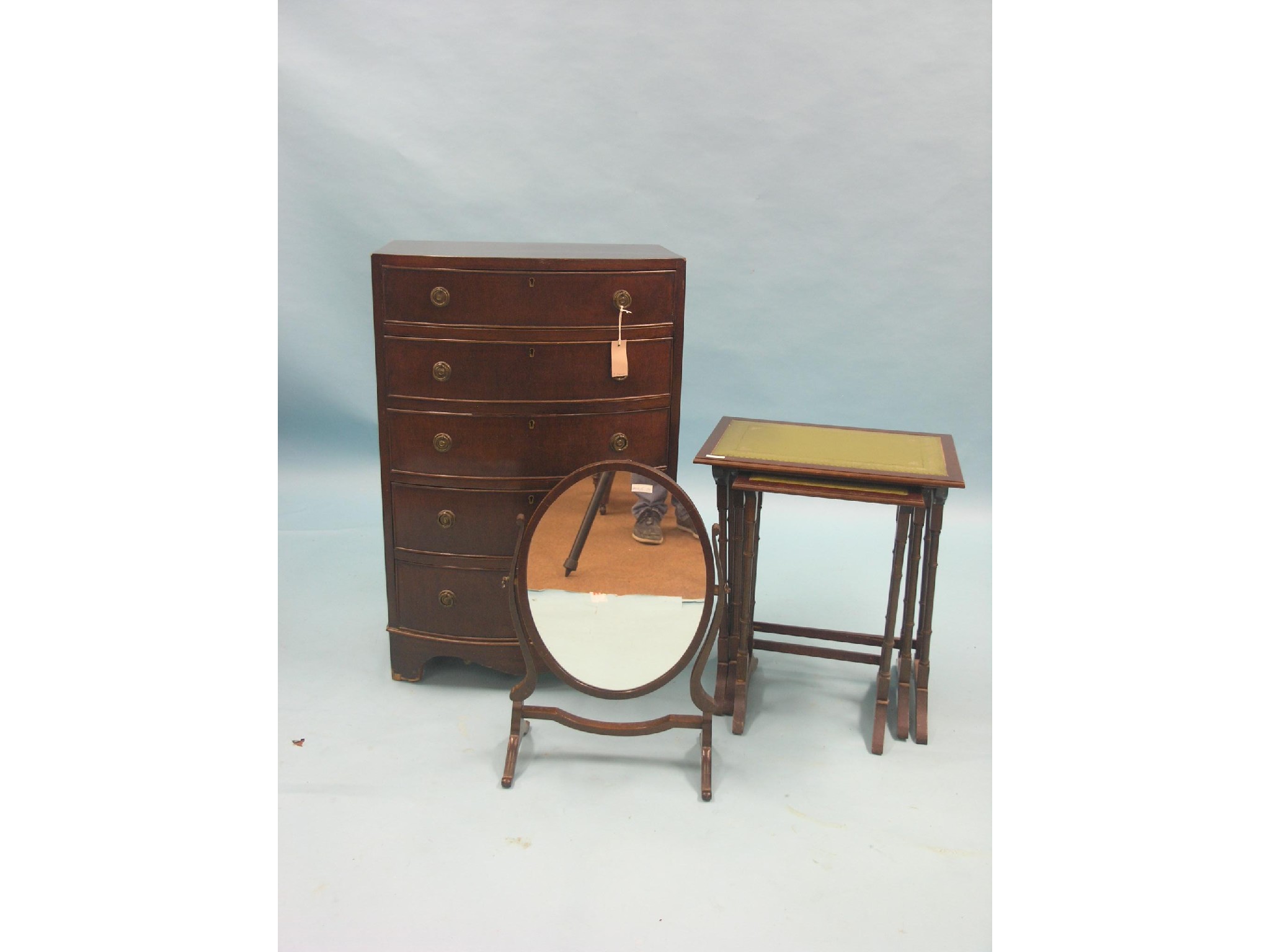 Appraisal: A mahogany bow-fronted chest five long drawers ft together with