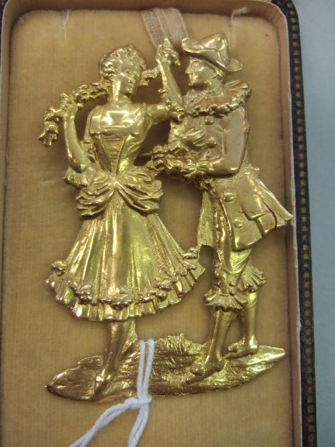 Appraisal: A gold brooch designed as the standing figures of a