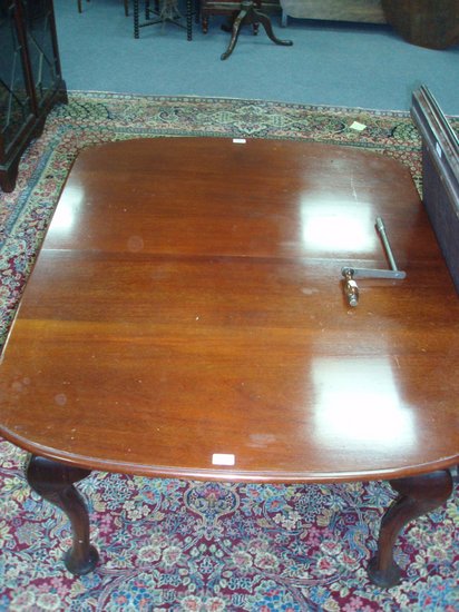 Appraisal: An early th Century mahogany dining table raised on cabriole