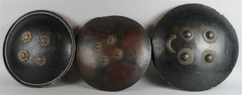 Appraisal: THREE RAJISTAN LEATHER SHIELDS each of circular form and studded