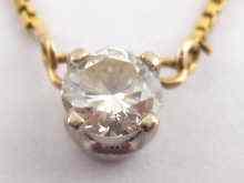 Appraisal: A yellow metal tests carat gold diamond solitaire pendant the