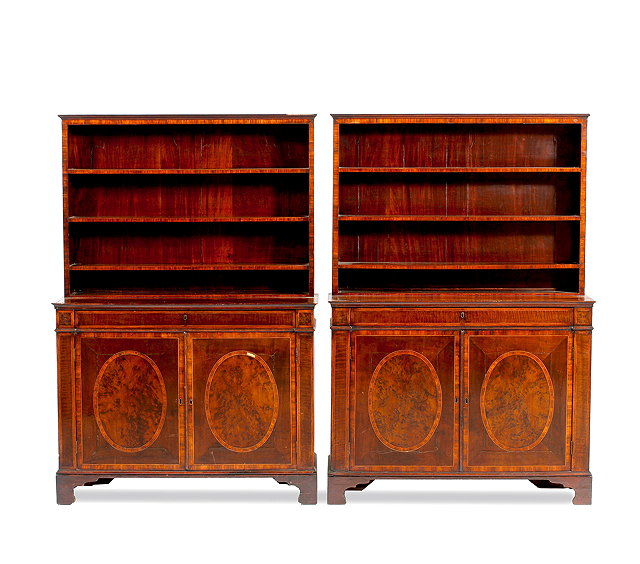 Appraisal: A PAIR OF GEORGE III MAHOGANY BOOKCASE CABINETS the superstructure