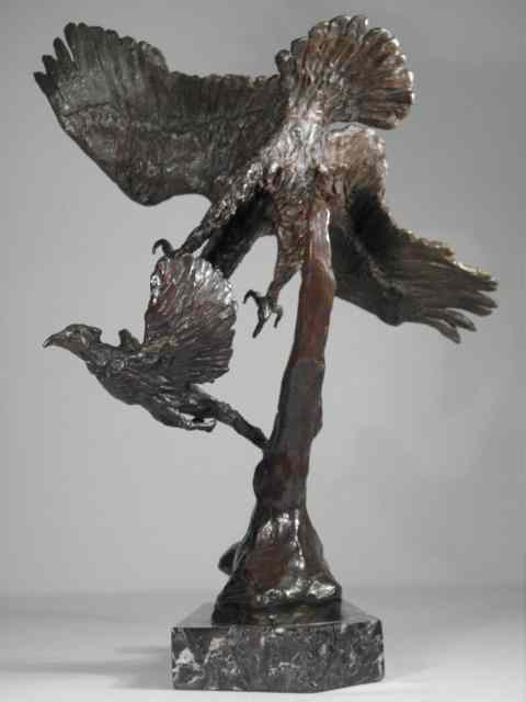 Appraisal: Bronze sculpture depicting two birds in flight one about to