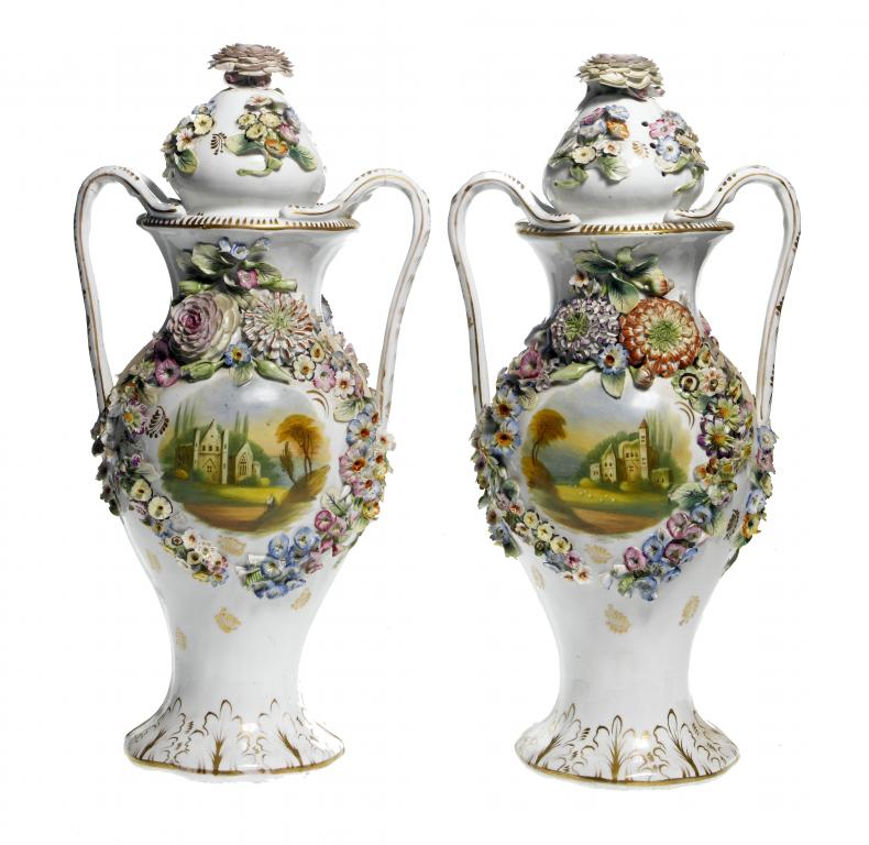 Appraisal: A PAIR OF STAFFORDSHIRE FLORAL ENCRUSTED POT POURRI VASES AND