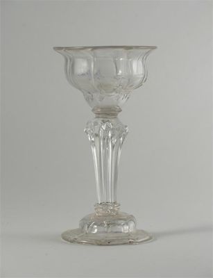 Appraisal: A sweetmeat glass with an ogee moulded bowl raised on