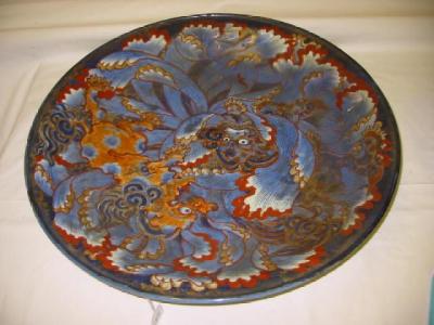 Appraisal: AN ORIENTAL PORCELAIN CHARGER painted with dragons in blue orange