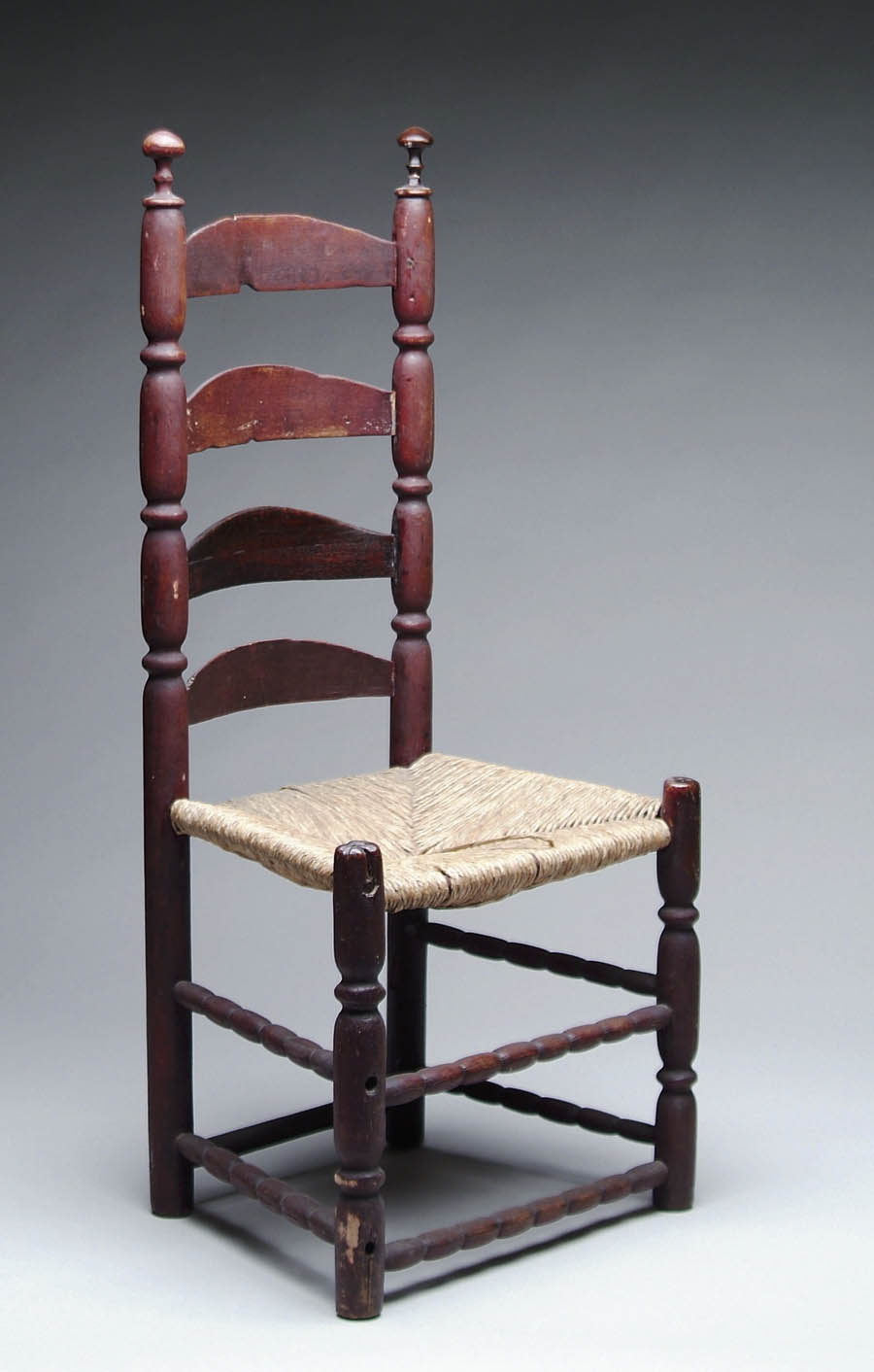 Appraisal: EARLY FOUR SLAT LADDER-BACK SIDE CHAIR IN RED Sausage turned