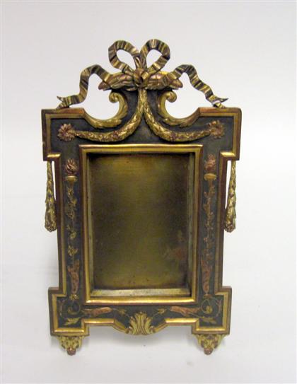 Appraisal: Louis XVI style gilt metal frameRibbon tied crest over rectangular