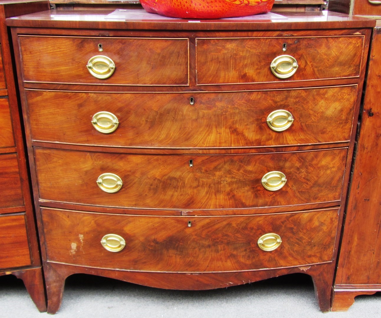 Appraisal: An early th century mahogany bowfront chest of two short