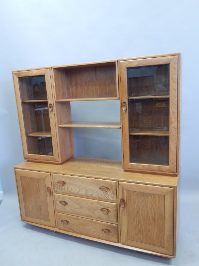 Appraisal: An Ercol light elm dresser unit the top with two