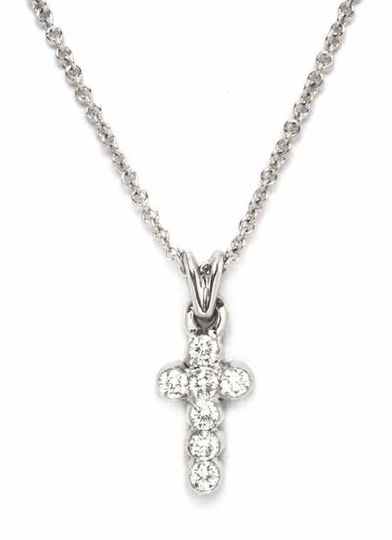 Appraisal: An Karat White Gold and Diamond Cross Pendant containing seven