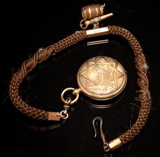 Appraisal: Victorian gold plated locket suspended from a Victorian braided hair