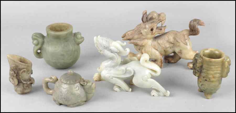 Appraisal: TWO CARVED SOAPSTONE DRAGONS Together with a soapstone teapot and