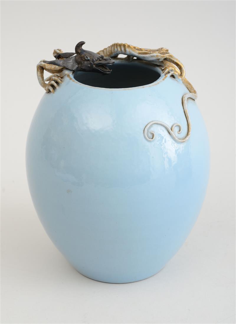 Appraisal: CHINESE LIGHT BLUE-GLAZED PORCELAIN VASE The ovoid vase applied with