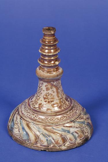 Appraisal: A RARE HISPANIO-MORESQUE CANDLESTICK BASE with blue and copper-lustre decoration