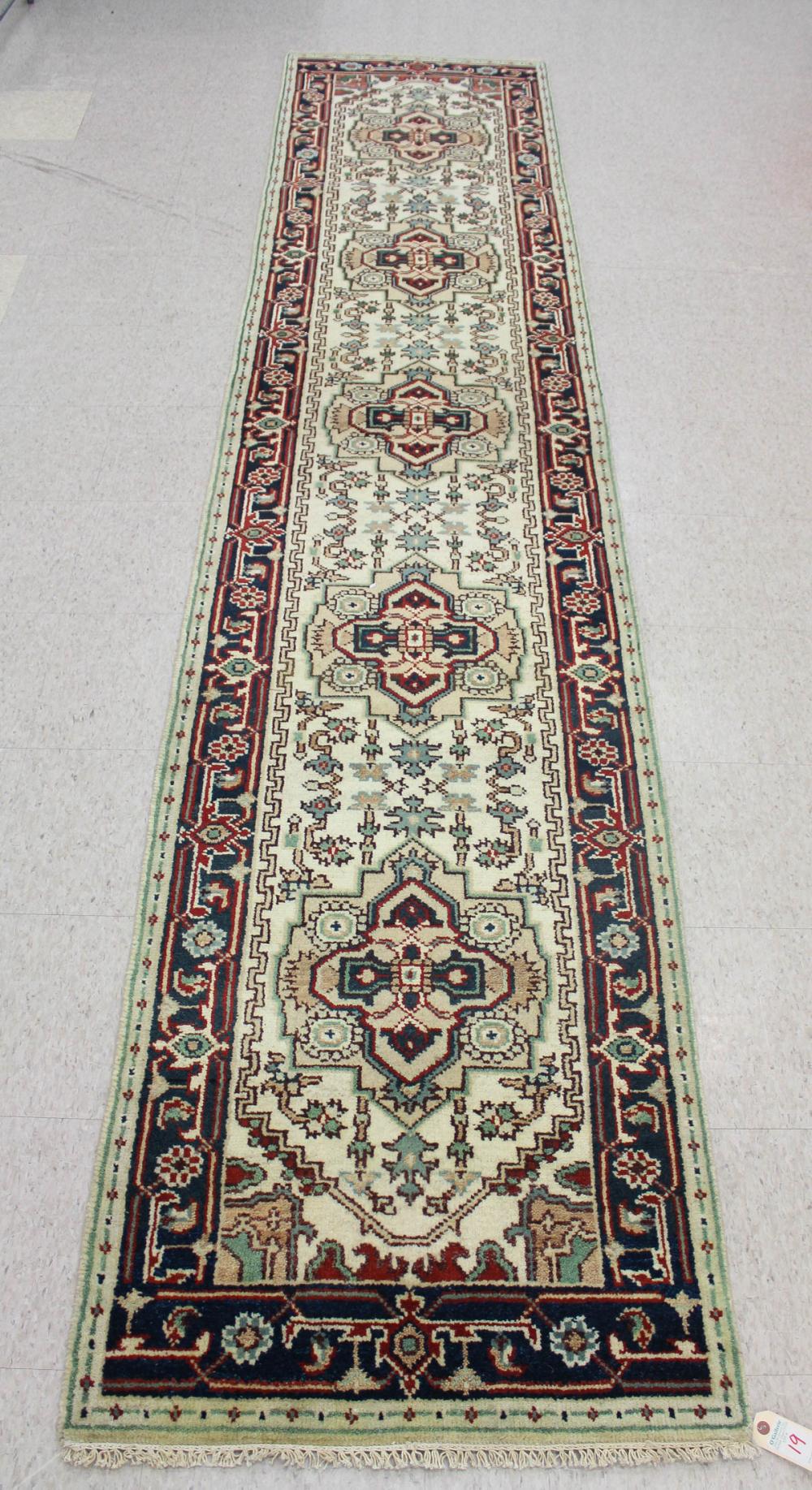 Appraisal: HAND KNOTTED ORIENTAL AREA RUG Indo-Persian five geometric medallions and