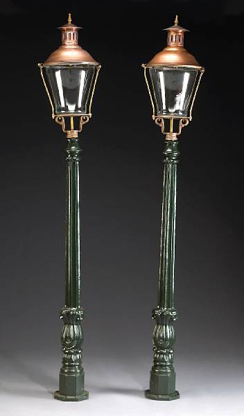 Appraisal: A set of four painted iron and copper garden torch