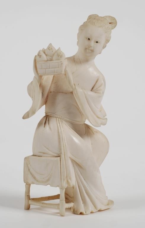 Appraisal: Antique Chinese carved ivory figurine Seated woman holding basket with