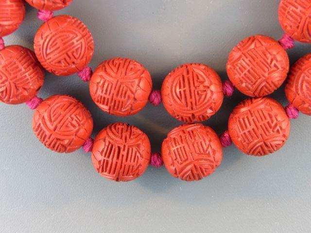 Appraisal: Chinese Carved Cinnabar Necklace beads mm long