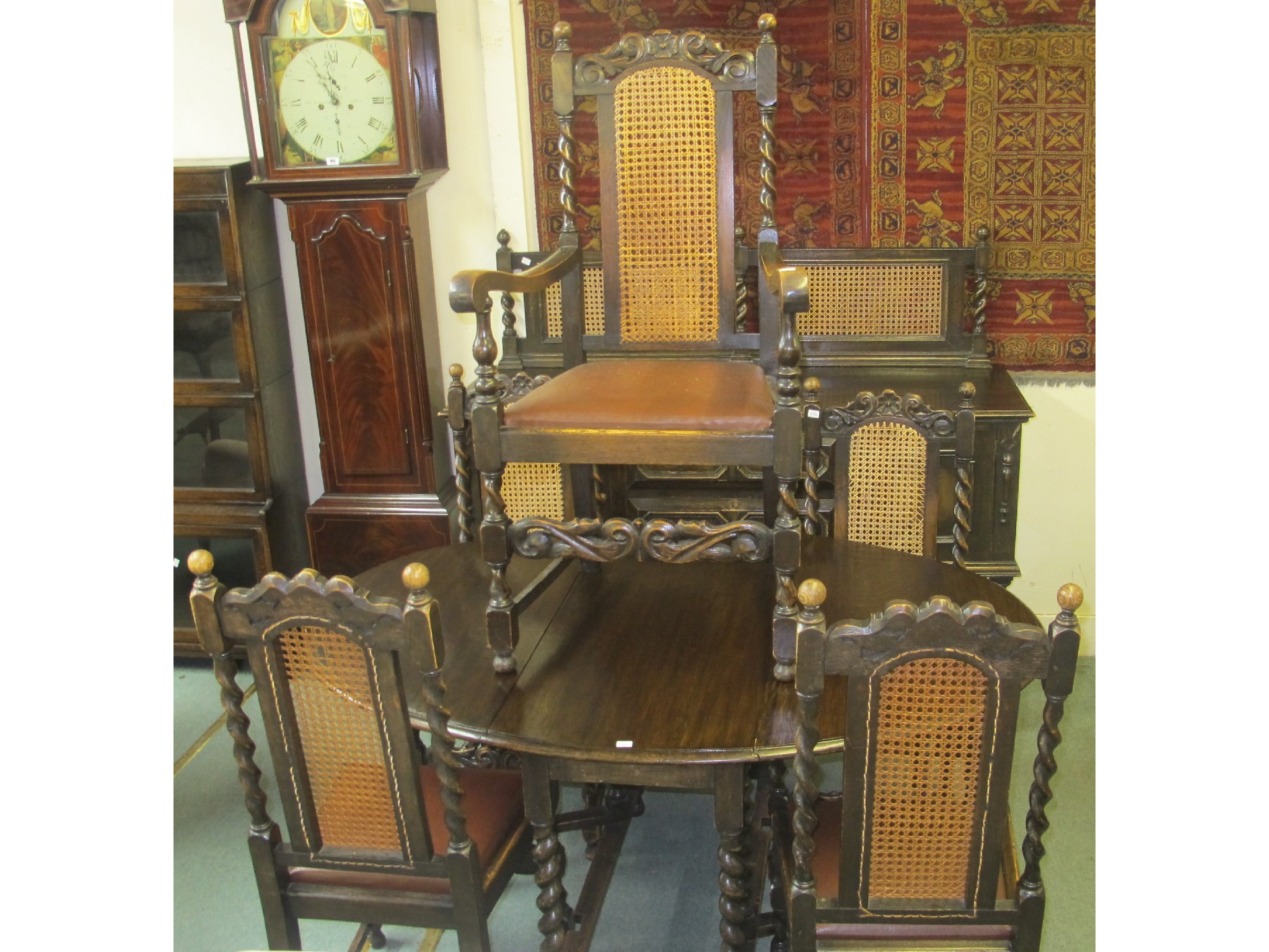 Appraisal: An oak oval dining table and five cane back chairs