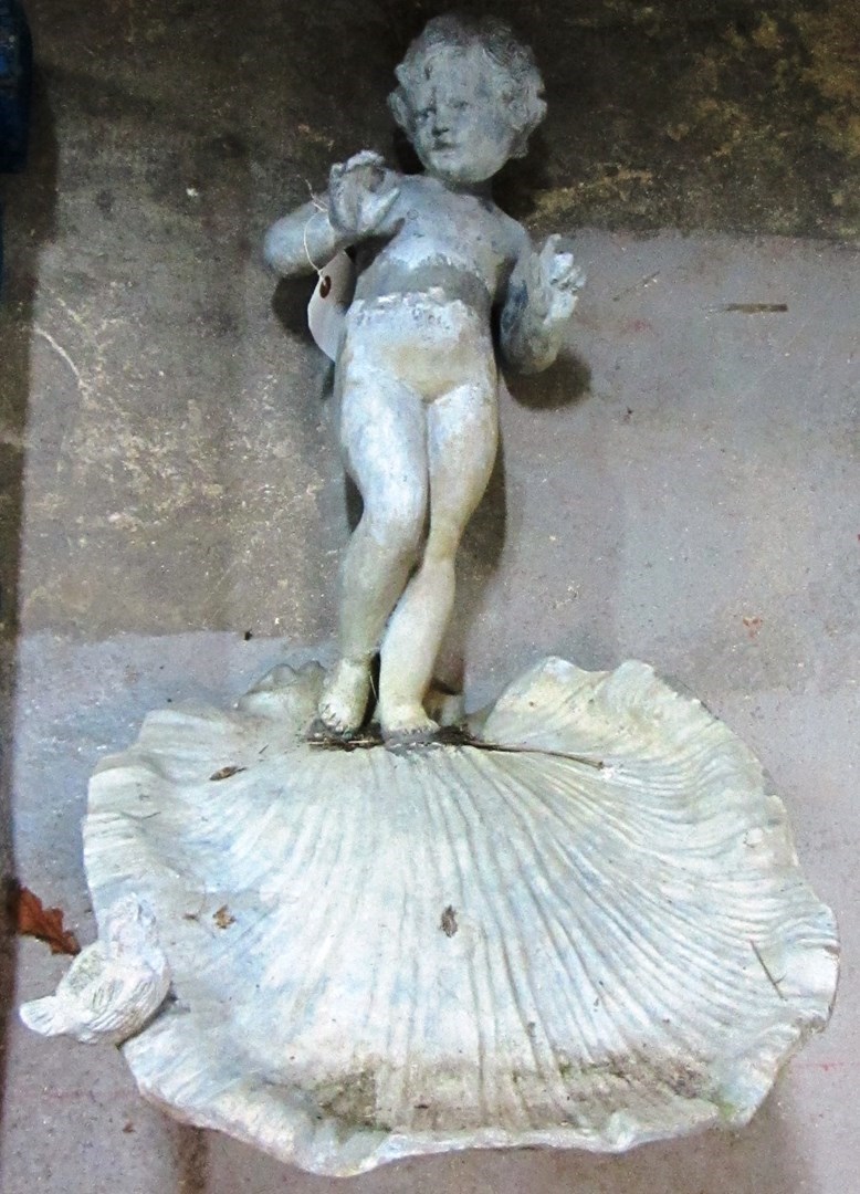 Appraisal: A th century lead figural bird bath with shell reservoir