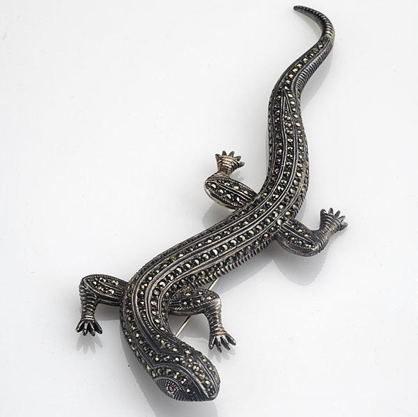 Appraisal: ART DECO SALAMANDER BROOCH Sterling and marcasite with garnet eyes