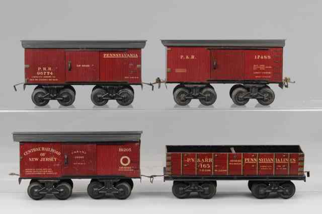 Appraisal: BING GAUGE FREIGHT CARS Lithographed maroon tin bodies black roofs