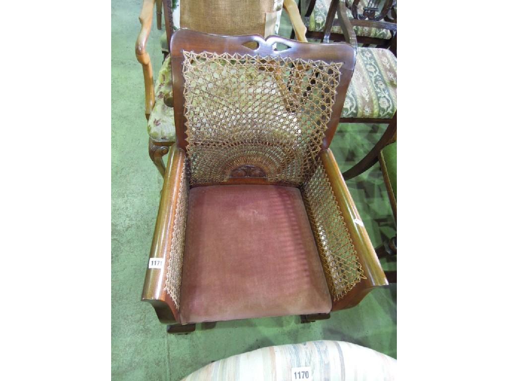 Appraisal: A walnut open elbow chair with cane panelled back shepherds