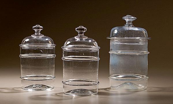 Appraisal: BLOWN GLASS STORAGE JARS American late th-early th century Three