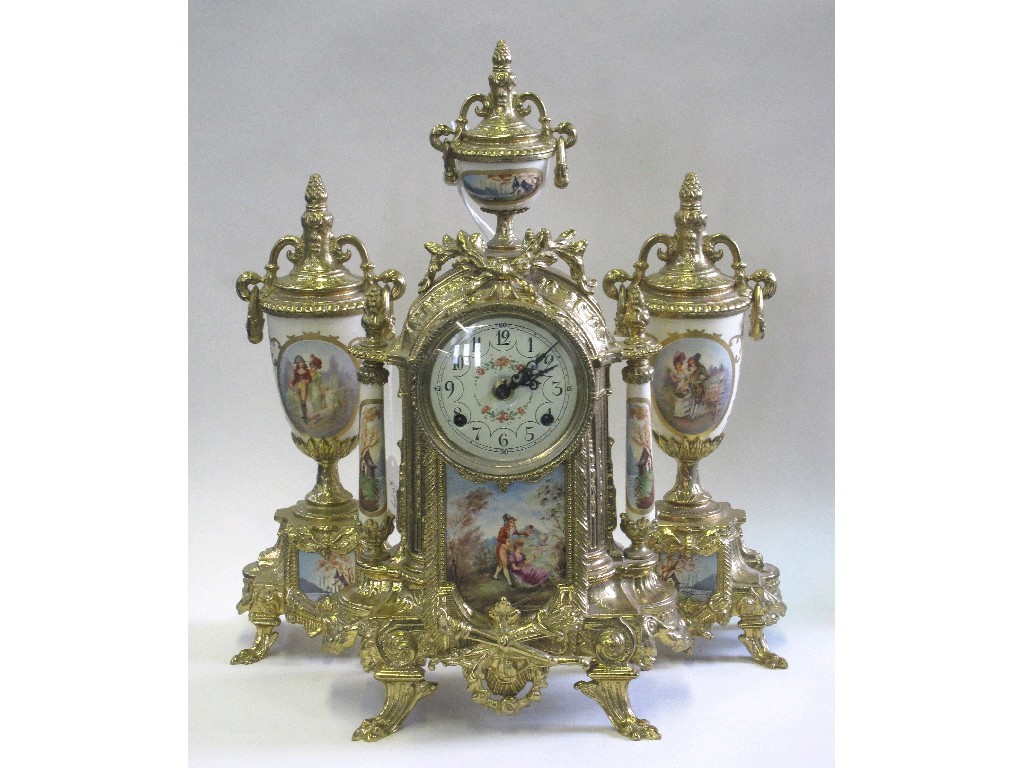 Appraisal: French style clock garniture in gilt metal with panel depicting