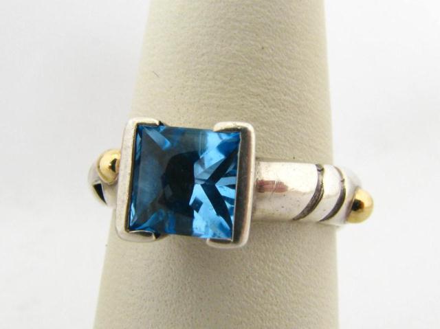 Appraisal: John Atencio sterling and K yellow gold blue topaz lady's