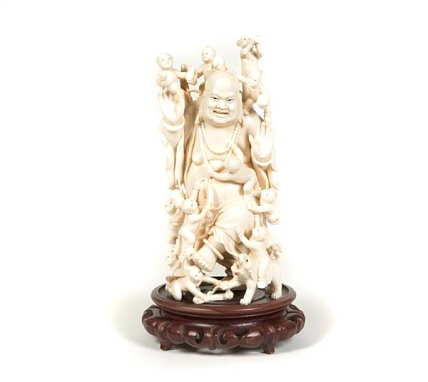 Appraisal: An ivory Budai with children height in width in depth