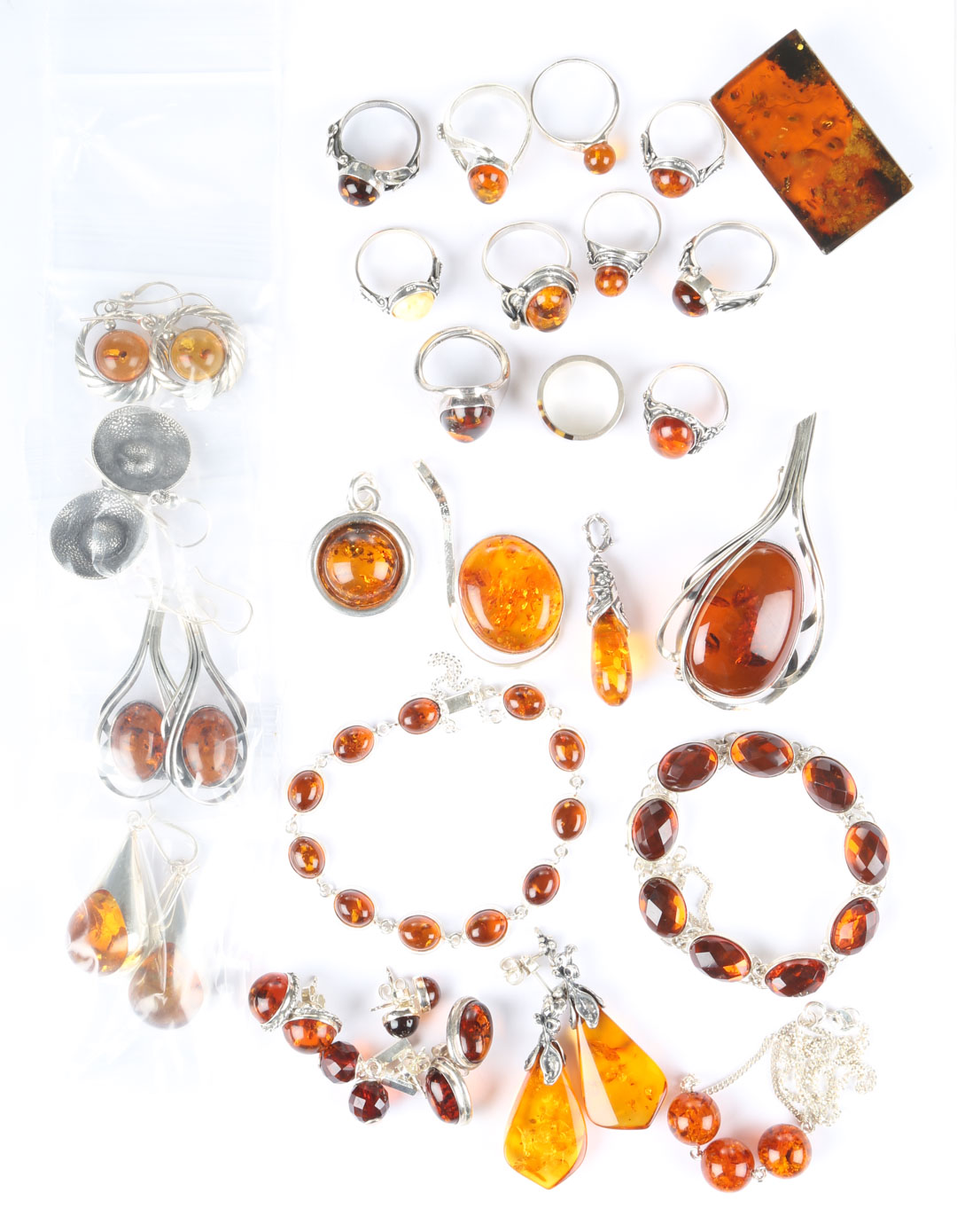 Appraisal: A Collection of Amber sterling silver and amber jewelry with