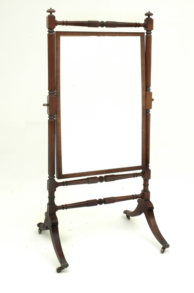 Appraisal: A REGENCY MAHOGANY CHEVEL MIRROR The rectangular plate supported by