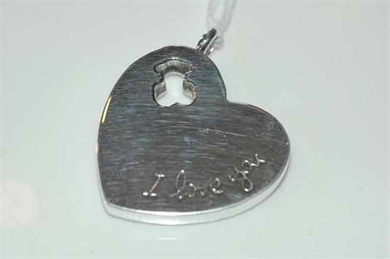 Appraisal: AN ENGRAVED HEART PENDANT