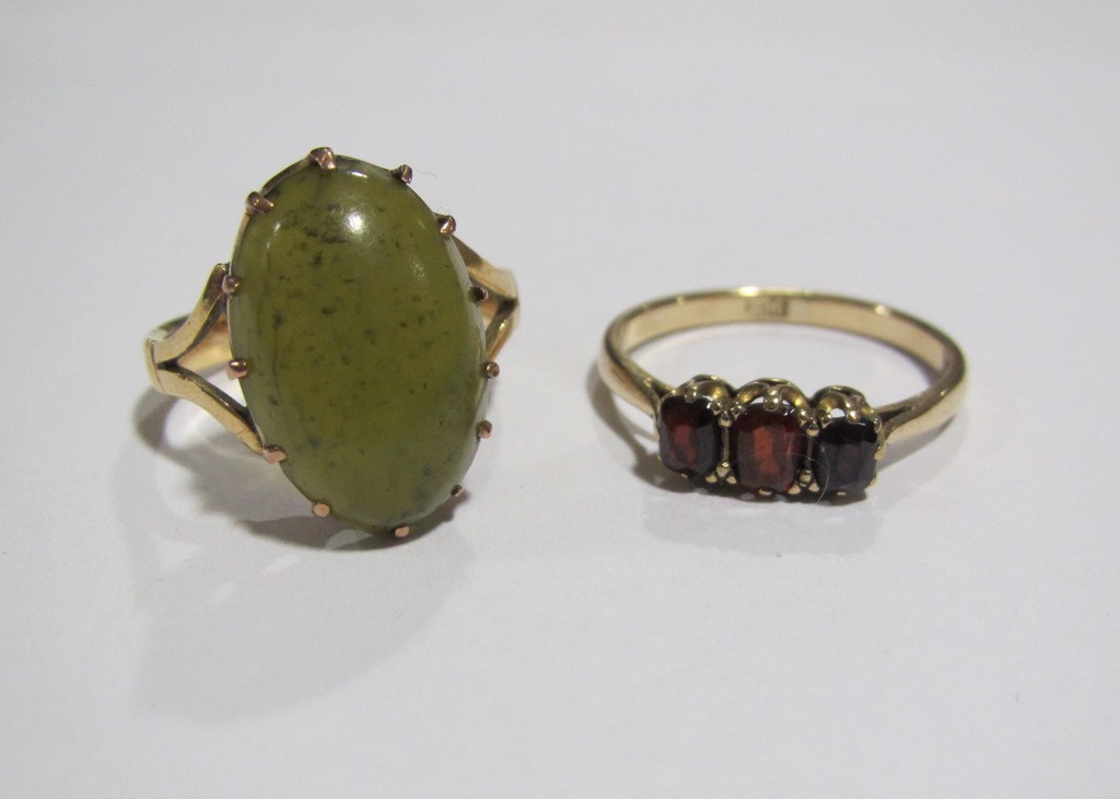 Appraisal: Lot comprising a ct gold garnet three stone ring and