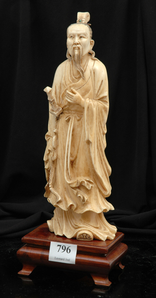 Appraisal: A CHINESE CARVED IVORY FIGURE OF AN IMMORTAL th Century