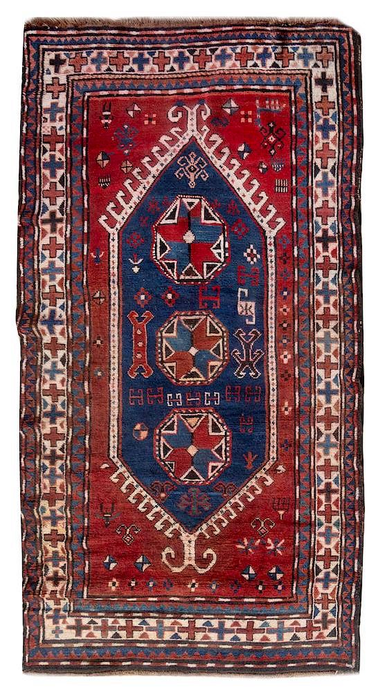 Appraisal: A Kazakh Wool Rug feet inches x feet inches A