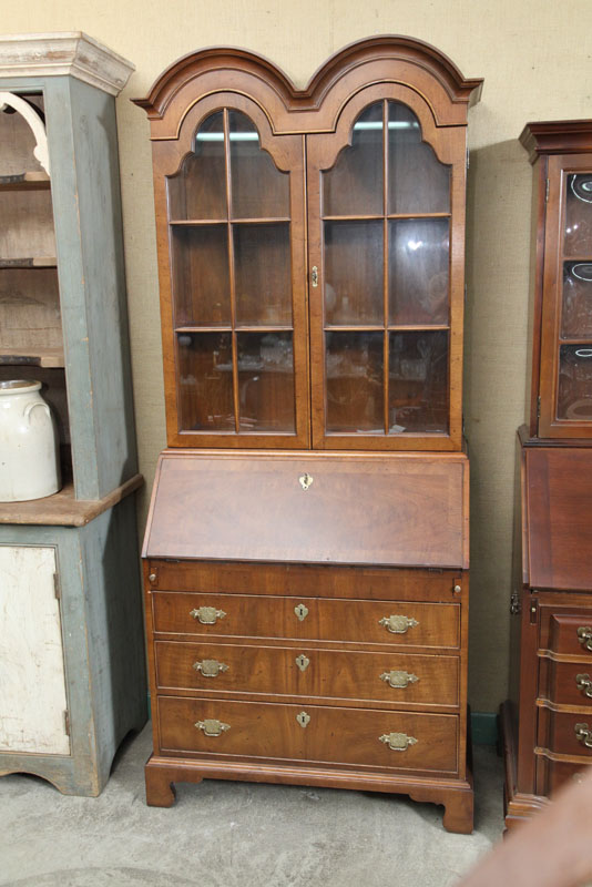 Appraisal: HENREDON SECRETARY BOOKCASE Mahogany veneered with a double arched cornice