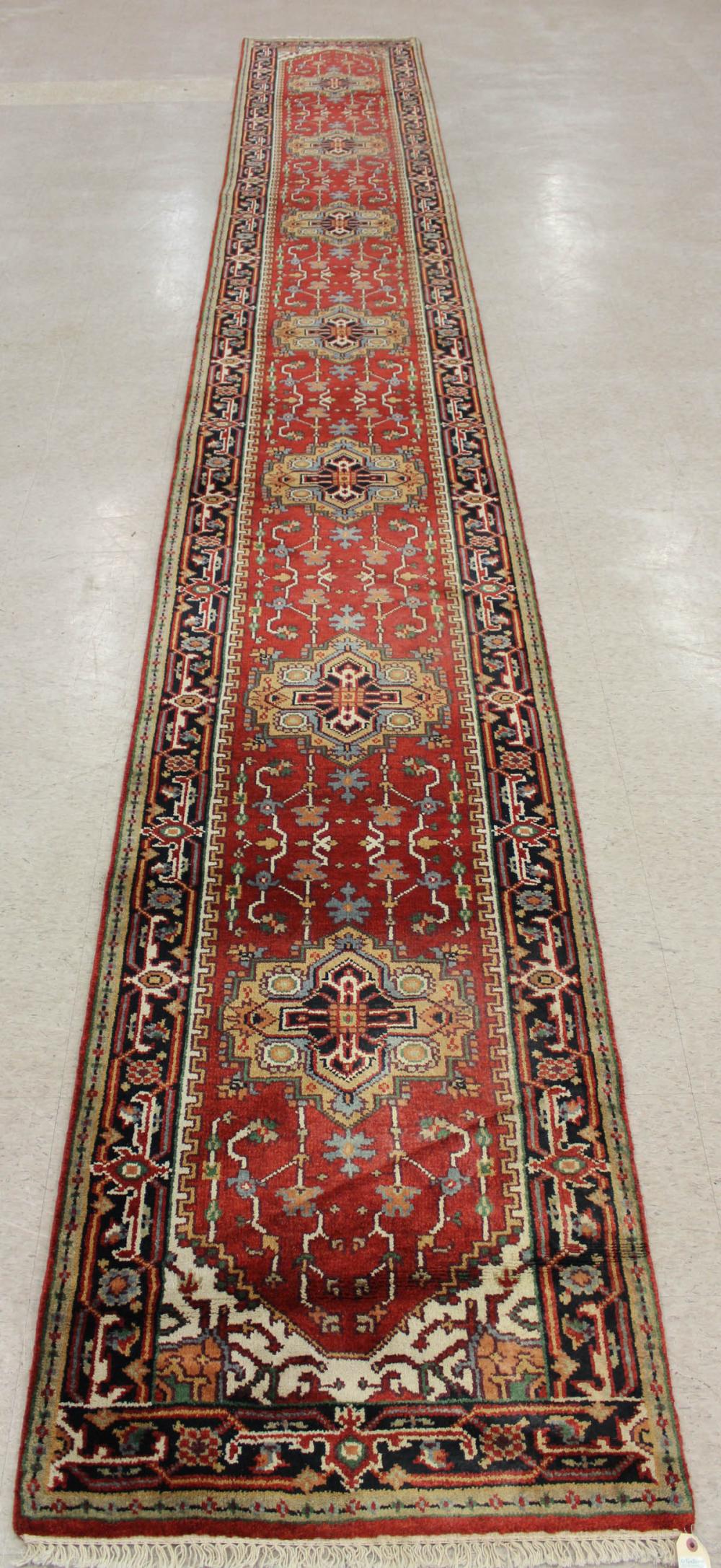 Appraisal: HAND KNOTTED ORIENTAL CORRIDOR RUG Indo-Persian Serab design on red